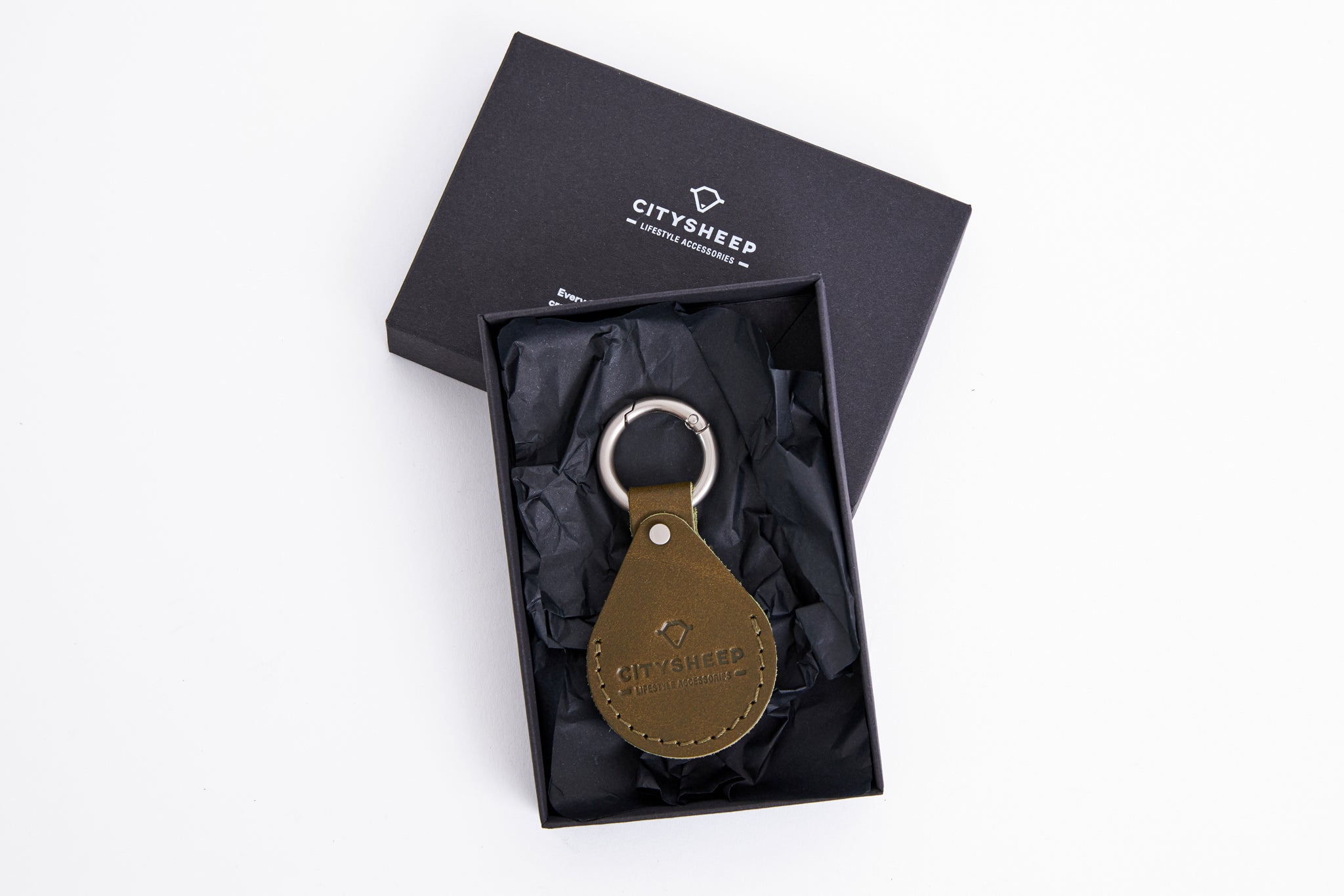 Green leather AirTag key holder fully covered