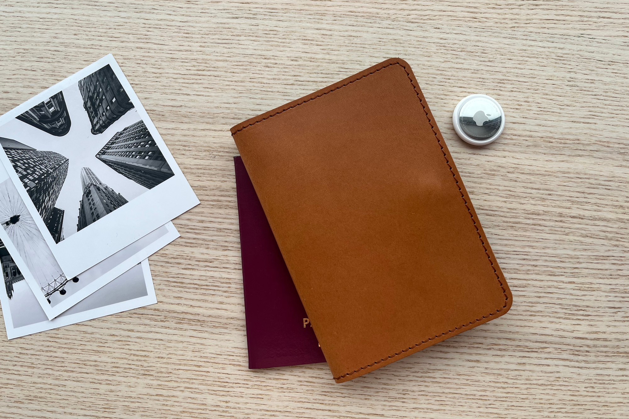 Passport wallet with AirTag holder in light brown color. Fits 2 passports and ID cards.