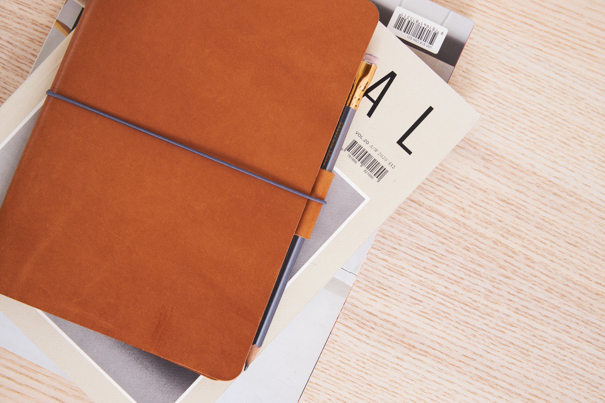 Refillable Leather journal made from vegetable tanned leather with a loop for a pen and pockets