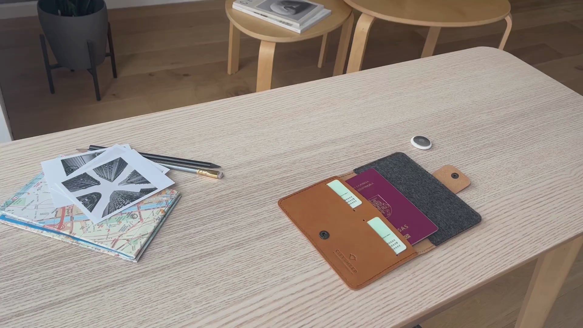 Leather passport holder with AirTag slot.