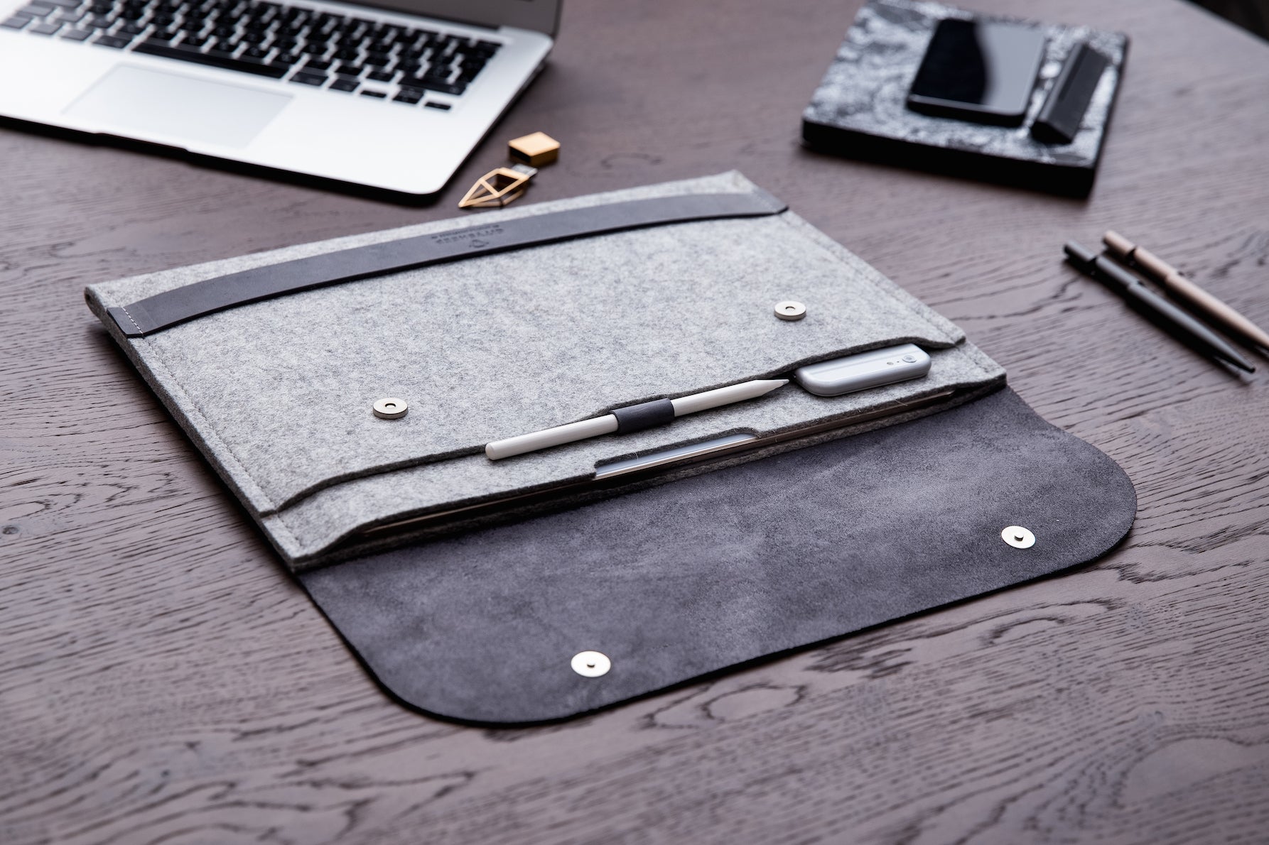 Handcrafted iPad case leather and wool felt compact size, exclusive design. Fits apple pencil, charger and other accessories.