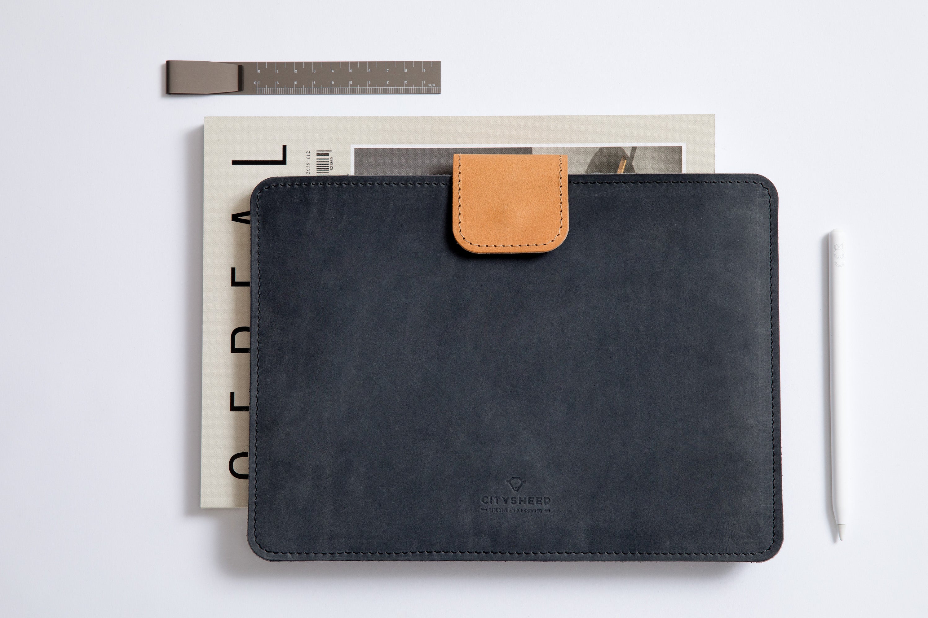 Stylish Full-grain leather iPad sleeve with magnetic closure for top protection. Features Apple Pencil holder.